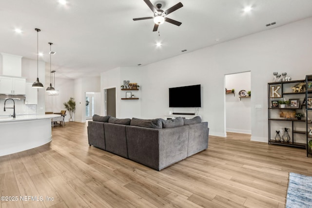 36039 Pitch Ln, Hilliard, FL 32046 - living room with a ceiling fan, light wood-style floors, baseboards, and recessed lighting