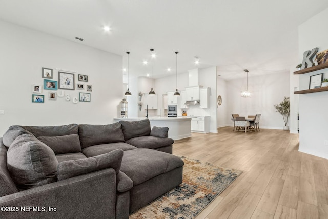 36039 Pitch Ln, Hilliard, FL 32046 - living room featuring light wood-style floors, recessed lighting, and baseboards