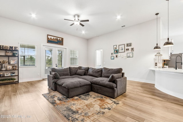 36039 Pitch Ln, Hilliard, FL 32046 - living room with ceiling fan, light wood-style flooring, french doors, recessed lighting, and baseboards
