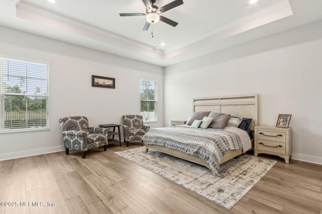 36039 Pitch Ln, Hilliard, FL 32046 - bedroom featuring a tray ceiling, crown molding, light wood-type flooring, baseboards, and recessed lighting