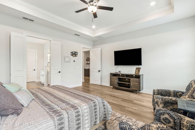 36039 Pitch Ln, Hilliard, FL 32046 - bedroom featuring wood finished floors, ornamental molding, baseboards, a tray ceiling, and recessed lighting