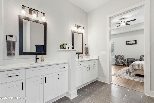 36039 Pitch Ln, Hilliard, FL 32046 - ensuite bathroom with tile patterned flooring, ceiling fan, two vanities, and baseboards