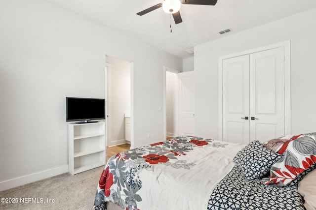 36039 Pitch Ln, Hilliard, FL 32046 - bedroom with a closet, light colored carpet, baseboards, and a ceiling fan