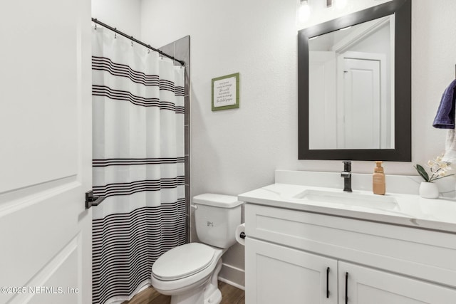 36039 Pitch Ln, Hilliard, FL 32046 - full bathroom featuring toilet, vanity, wood finished floors, and a shower with shower curtain