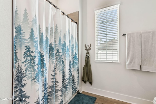 36039 Pitch Ln, Hilliard, FL 32046 - full bath featuring wood finished floors, baseboards, and curtained shower