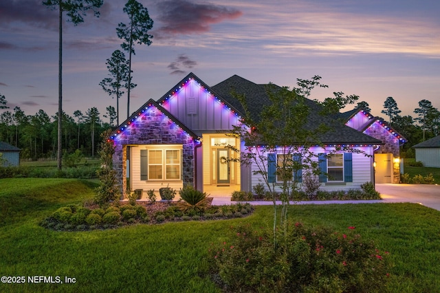 36039 Pitch Ln, Hilliard, FL 32046 - view of front of property with a yard, stone siding, and board and batten siding