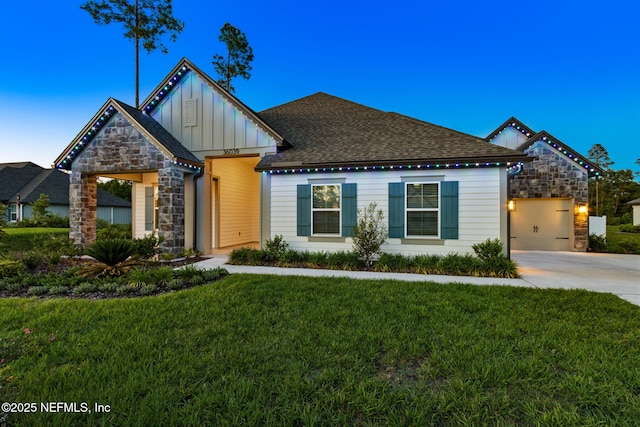 36039 Pitch Ln, Hilliard, FL 32046 - view of front of property featuring board and batten siding, a front yard, stone siding, and driveway