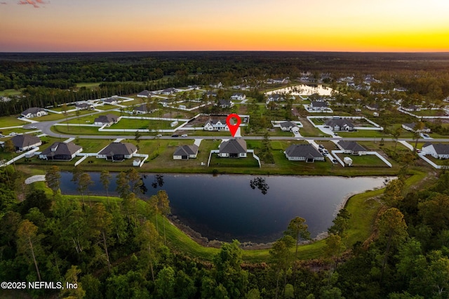 36039 Pitch Ln, Hilliard, FL 32046 - aerial view of property and surrounding area with a large body of water, a forest, and nearby suburban area