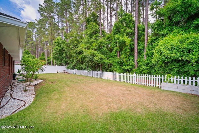 view of yard featuring a fenced backyard