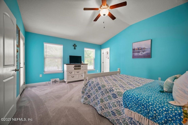 bedroom with baseboards, ceiling fan, vaulted ceiling, and carpet flooring