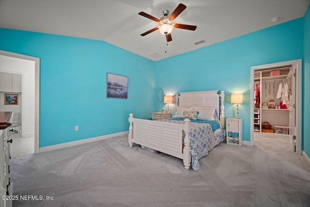 carpeted bedroom with visible vents, a ceiling fan, baseboards, and lofted ceiling