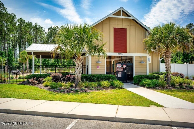 view of building exterior with fence