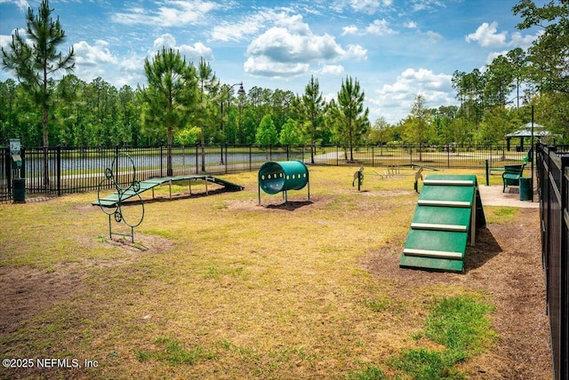 surrounding community featuring fence and a yard