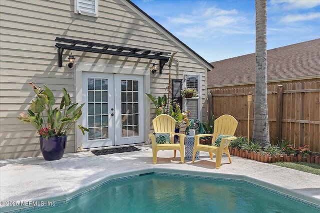 12322 Mastin Cove Rd, Jacksonville, FL 32225 - swimming pool featuring french doors, fence, and a patio area