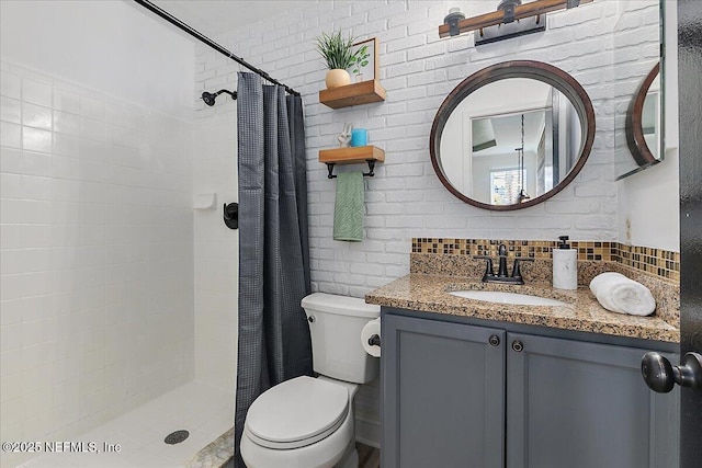 12322 Mastin Cove Rd, Jacksonville, FL 32225 - full bathroom featuring toilet, a shower stall, vanity, and decorative backsplash