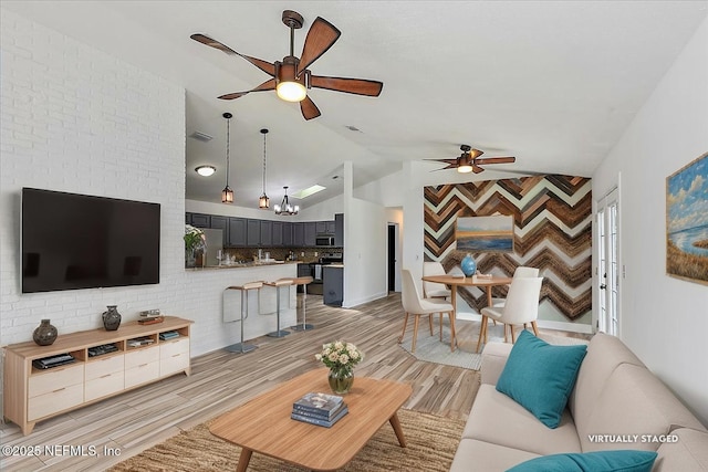 12322 Mastin Cove Rd, Jacksonville, FL 32225 - living room featuring a ceiling fan, lofted ceiling, and light wood-style floors