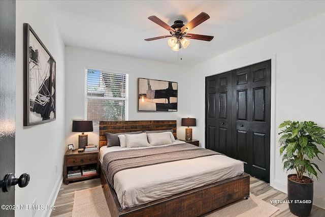 12322 Mastin Cove Rd, Jacksonville, FL 32225 - bedroom with baseboards, light wood-style flooring, a closet, and a ceiling fan