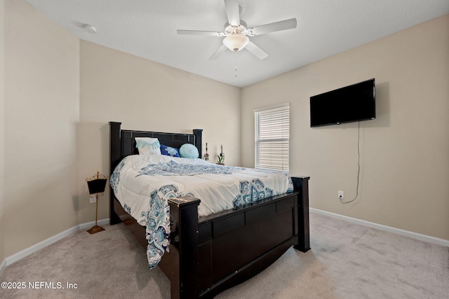 carpeted bedroom with baseboards and ceiling fan