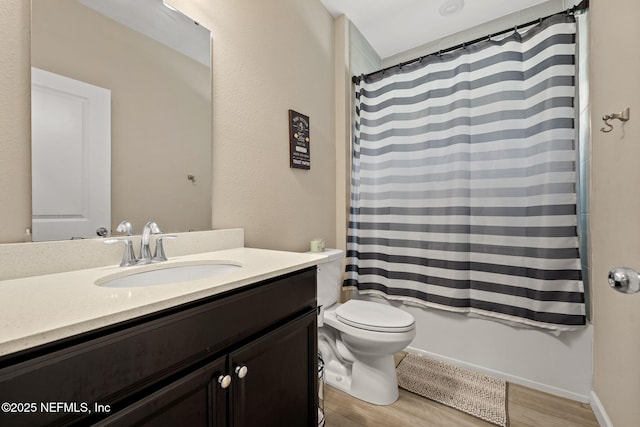 full bathroom with vanity, shower / bathtub combination with curtain, toilet, and wood finished floors