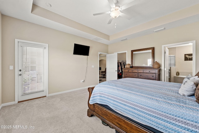 bedroom featuring carpet floors, baseboards, a spacious closet, and visible vents