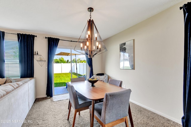 2471 Cold Stream Ln, Green Cove Springs, FL 32043 - dining area featuring a chandelier, plenty of natural light, light colored carpet, and baseboards