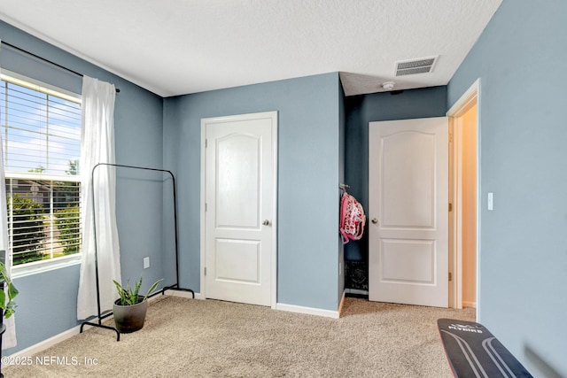 2471 Cold Stream Ln, Green Cove Springs, FL 32043 - carpeted bedroom with baseboards and a textured ceiling