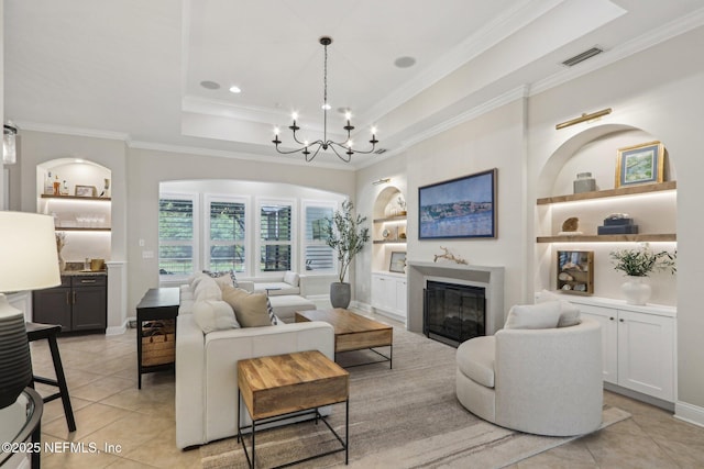 90 Kenmore Ave, Ponte Vedra, FL 32081 - living area featuring ornamental molding, a tray ceiling, built in features, light tile patterned flooring, and a chandelier