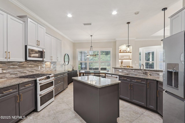 90 Kenmore Ave, Ponte Vedra, FL 32081 - kitchen with white appliances, a sink, decorative backsplash, crown molding, and light stone counters