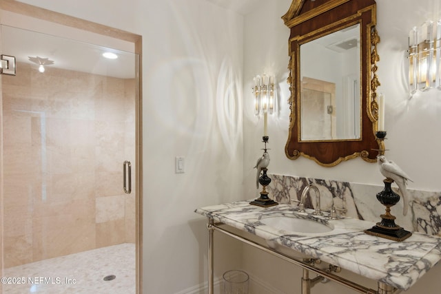 full bathroom featuring a shower stall and vanity