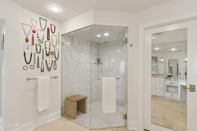bathroom featuring a shower stall, vanity, and tile patterned floors