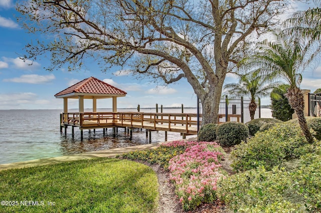 dock area with a gazebo and a water view