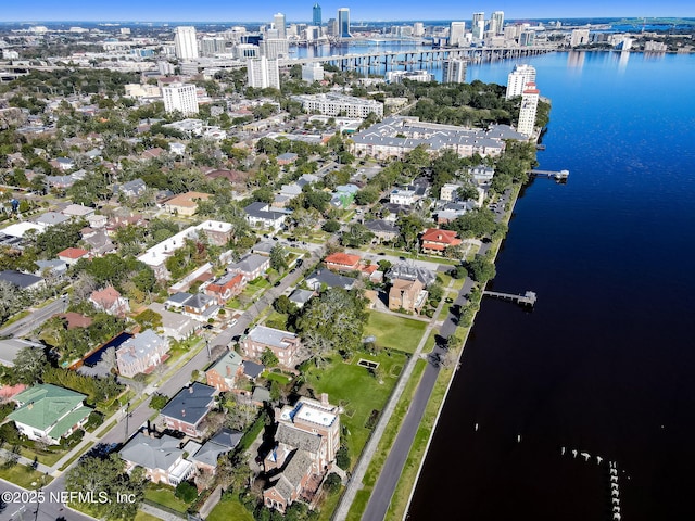 view of property location featuring a large body of water and nearby urban area