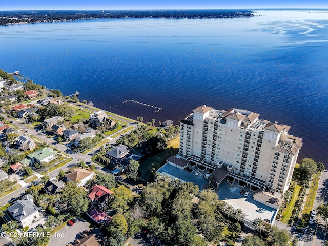 aerial overview of property's location featuring a large body of water and apartment complex / building
