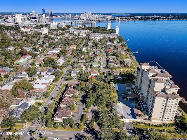 aerial overview of property's location with a nearby body of water and nearby urban area