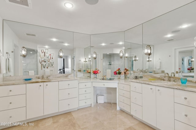 bathroom with a shower with shower door, vanity, recessed lighting, and tile patterned flooring