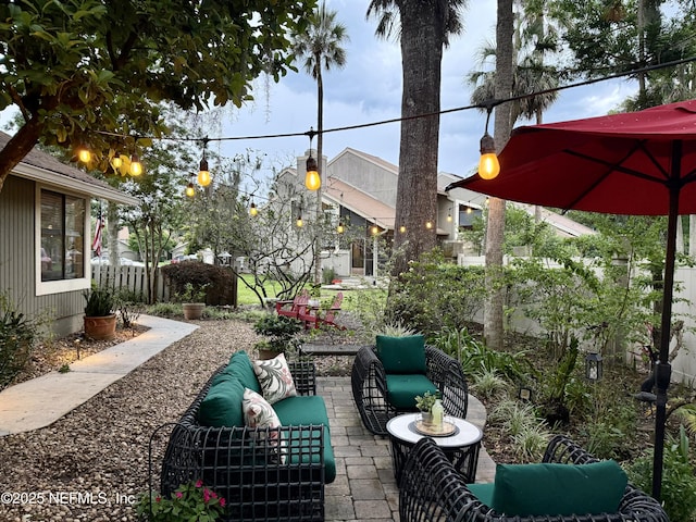 view of patio / terrace with an outdoor hangout area and fence