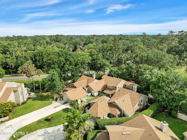 aerial perspective of suburban area featuring a forest