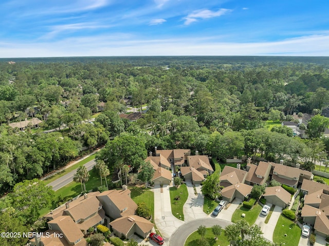 aerial view of residential area with a forest