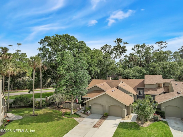 view of front of property with roof with shingles, driveway, a garage, a front lawn, and stucco siding
