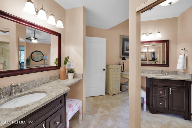 bathroom with two vanities and ceiling fan
