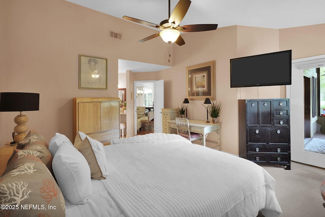 bedroom with light colored carpet and a ceiling fan