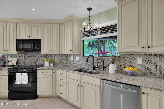 kitchen with cream cabinetry, black appliances, a sink, a chandelier, and decorative backsplash