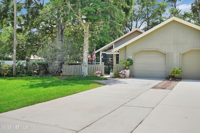 view of front of property with concrete driveway and an attached garage