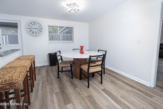 3165 Victoria Park Rd, Jacksonville, FL 32216 - dining area with light wood-style floors, baseboards, and a wealth of natural light