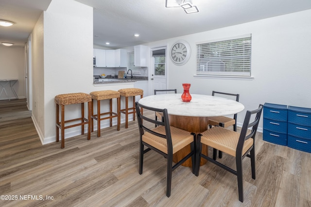 3165 Victoria Park Rd, Jacksonville, FL 32216 - dining area with baseboards, recessed lighting, and light wood finished floors