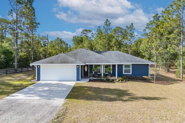 single story home with an attached garage, fence, driveway, and a front lawn