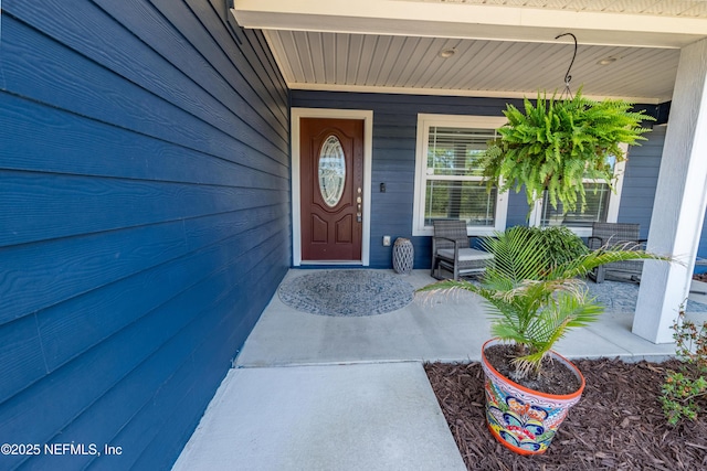 property entrance featuring a porch