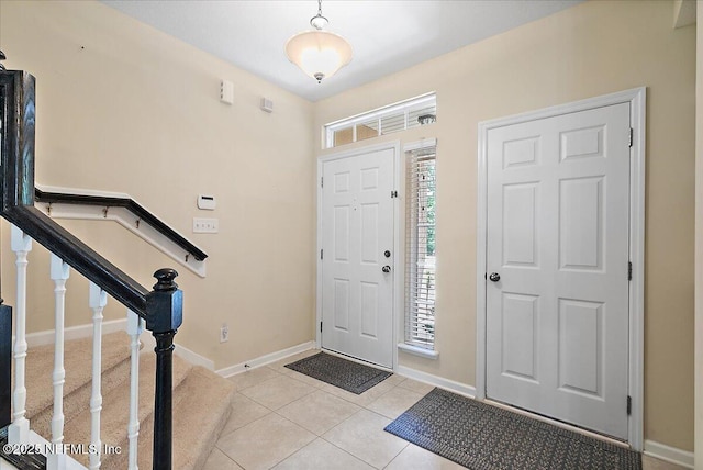 229 Adelanto Ave, Saint Augustine, FL 32092 - foyer with baseboards and light tile patterned floors