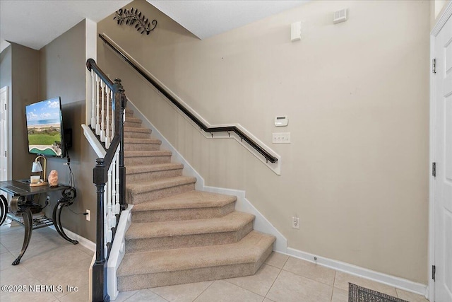 229 Adelanto Ave, Saint Augustine, FL 32092 - staircase featuring tile patterned flooring and baseboards