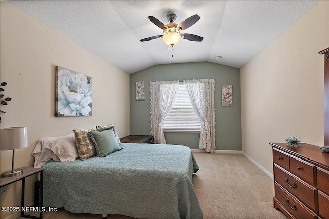 229 Adelanto Ave, Saint Augustine, FL 32092 - bedroom with light carpet, vaulted ceiling, baseboards, and a ceiling fan
